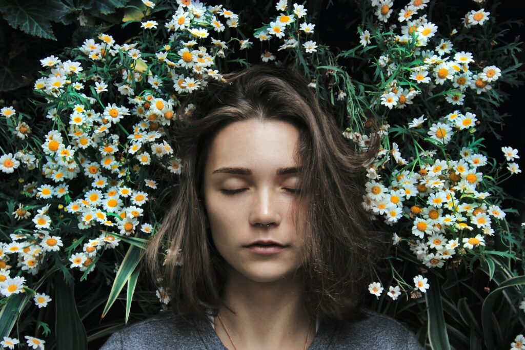 Woman with plants on background